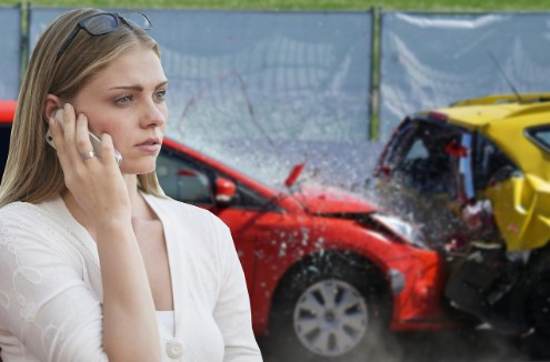 Woman calls her insurance agency after a vehicle accident.