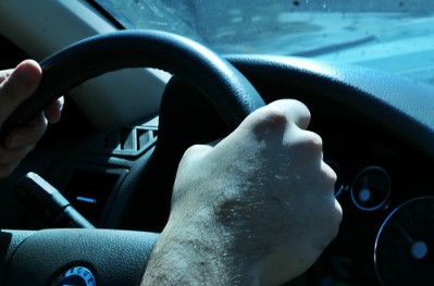 Chicago driver gripping the steering wheel.