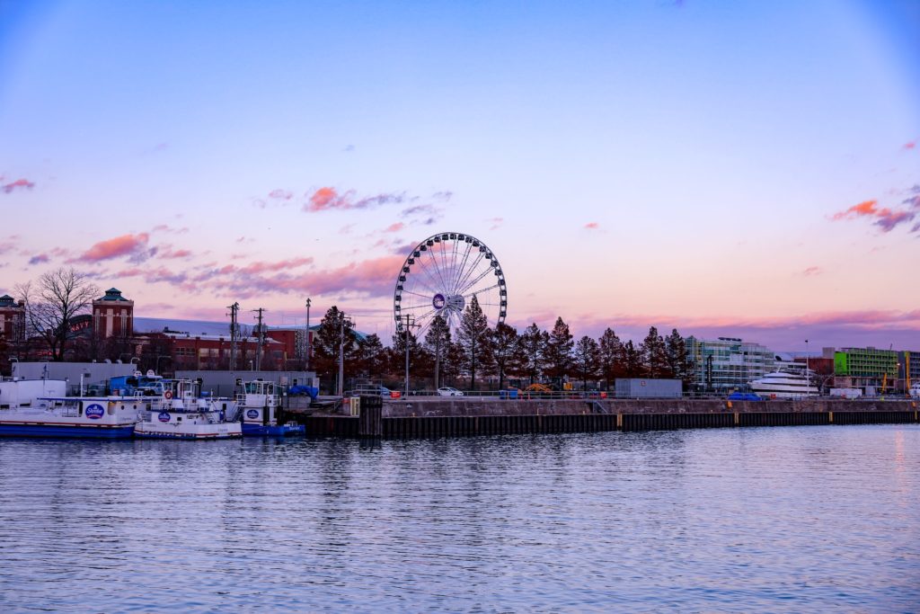 A wide shot of the ferris wheel and children's museum at Navy Pier in Chicago, IL
