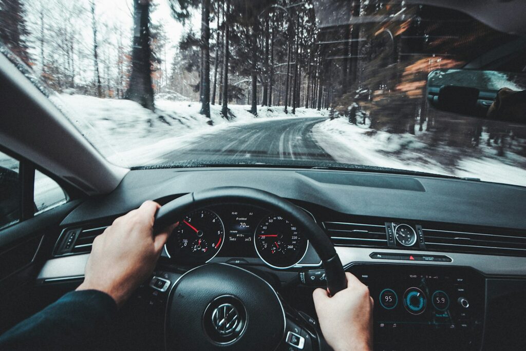 A person driving a Volkswagen down a snowy road in Illinois.