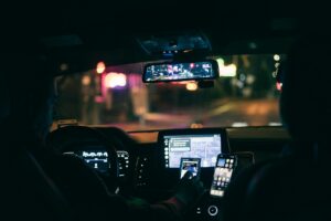Man Driving Rideshare Car at Night