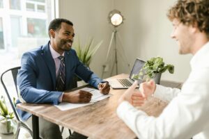 Insurance agent and client at a table